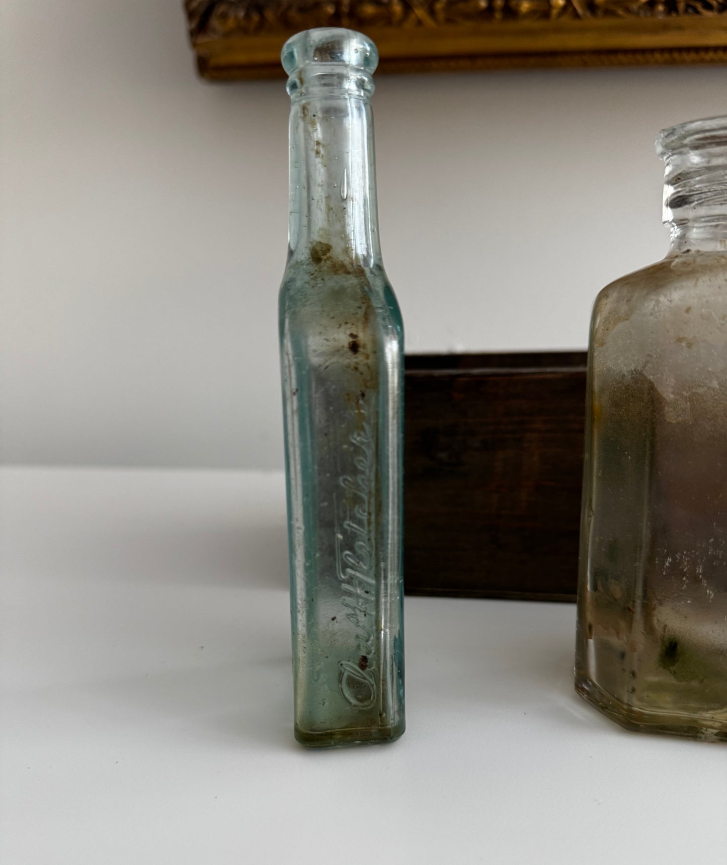 Antique Apothecary Bottle Collection In Vintage Wooden Trough