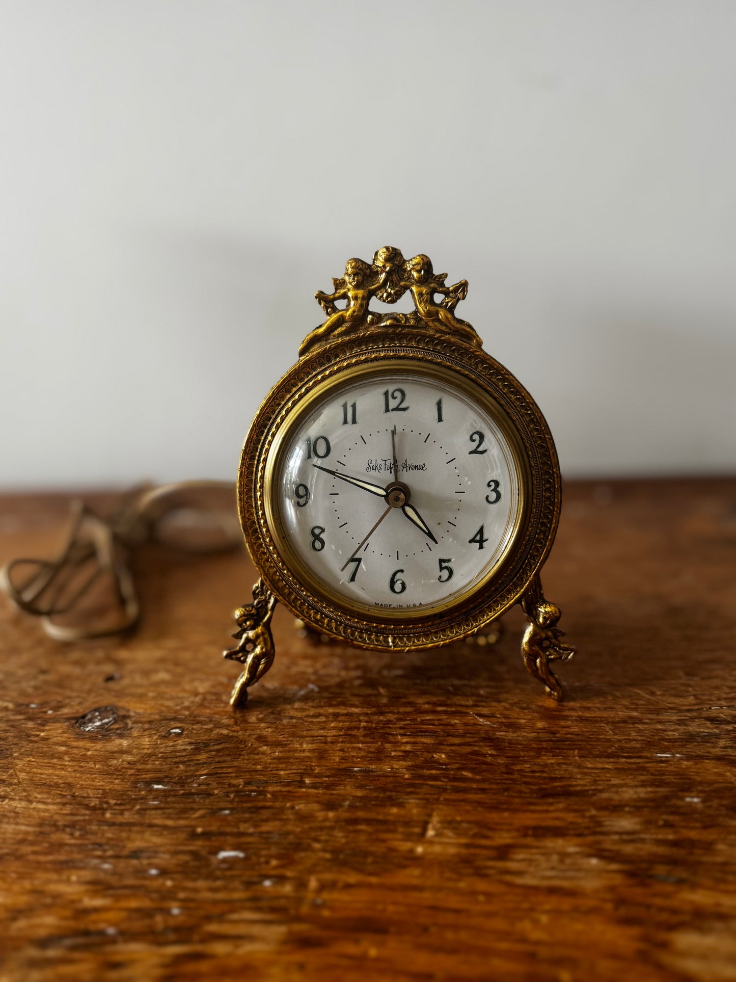 Vintage Saks Fifth Avenue Gold tone Plug-in Clock Cherub Designed