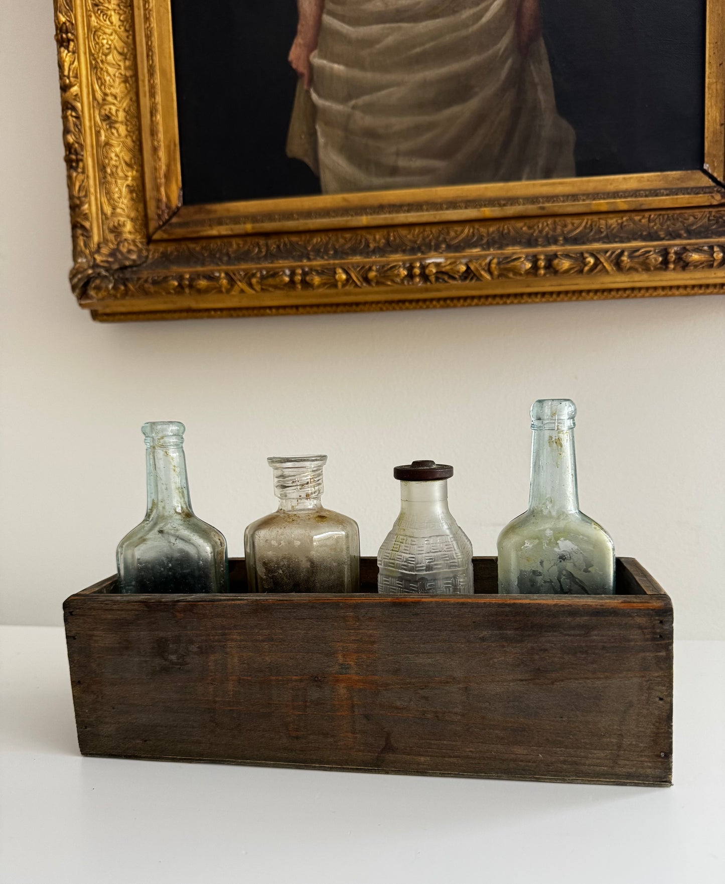 Antique Apothecary Bottle Collection In Vintage Wooden Trough