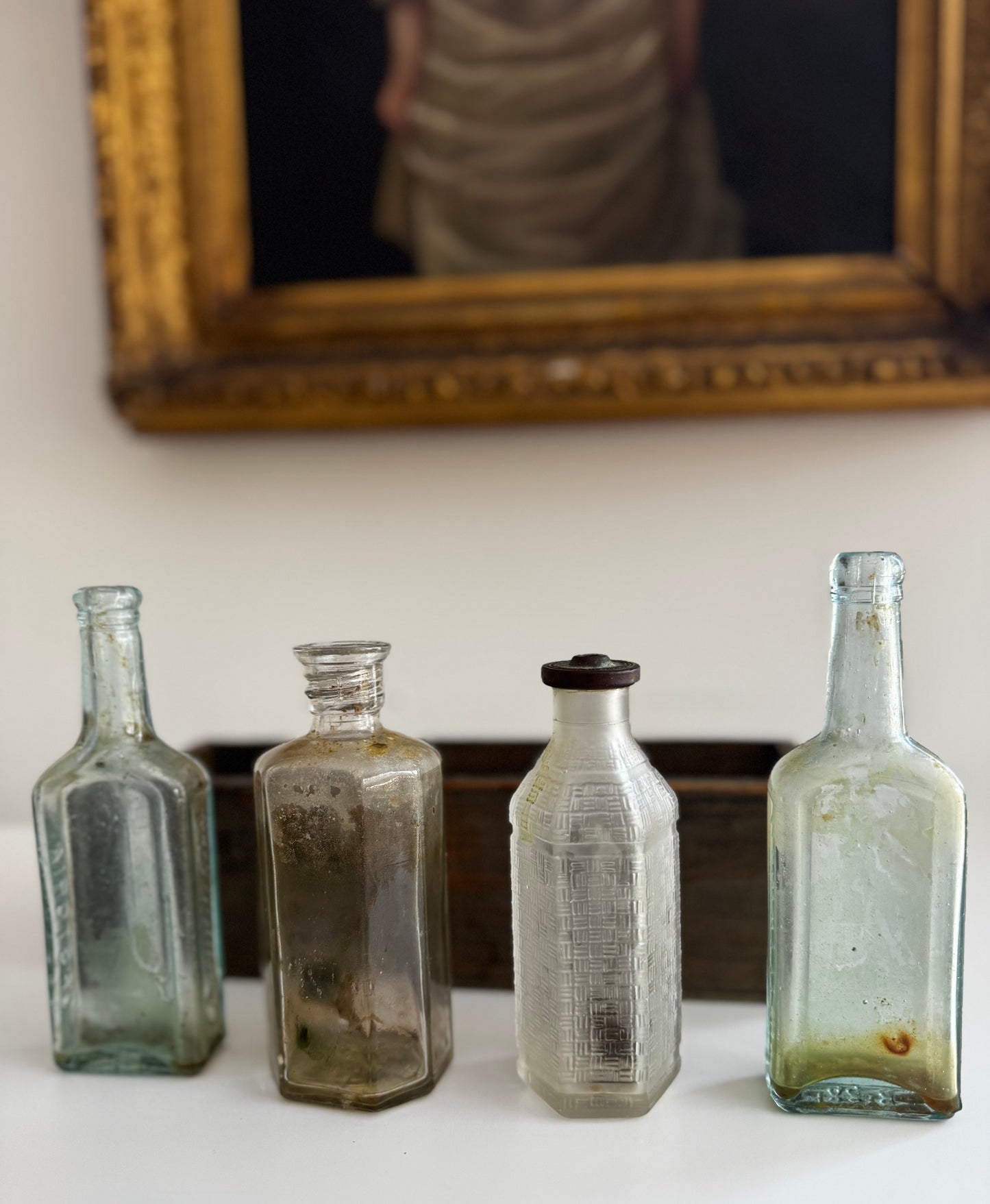 Antique Apothecary Bottle Collection In Vintage Wooden Trough